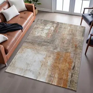 Photo of Copper Gray And Ivory Abstract Washable Area Rug With UV Protection