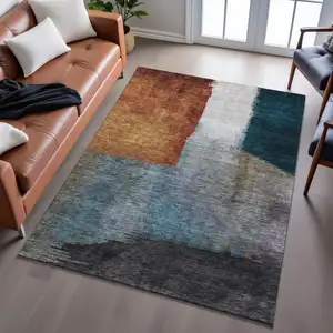 Photo of Copper Ivory And Teal Abstract Washable Area Rug With UV Protection