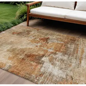 Photo of Copper Rust And Beige Abstract Washable Indoor Outdoor Area Rug