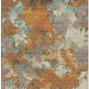 Photo of Copper Taupe And Orange Abstract Washable Area Rug With UV Protection