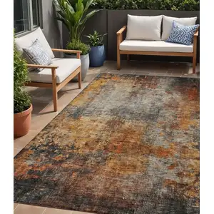 Photo of Copper Terra Cotta And Black Abstract Washable Indoor Outdoor Area Rug