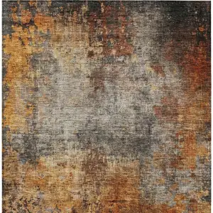 Photo of Copper Terra Cotta And Black Abstract Washable Indoor Outdoor Area Rug