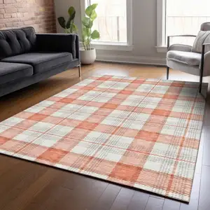 Photo of Coral And Beige Plaid Washable Indoor Outdoor Area Rug