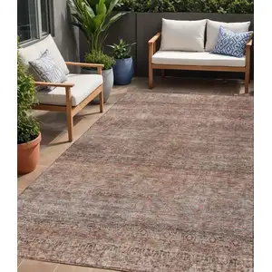 Photo of Coral And Black Striped Washable Indoor Outdoor Area Rug