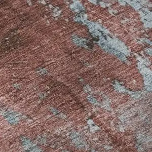 Photo of Coral And Blue Abstract Washable Area Rug With UV Protection