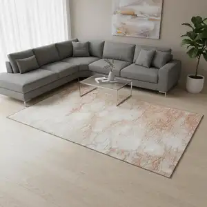 Photo of Coral And Ivory Abstract Washable Area Rug With UV Protection