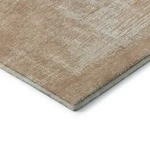 Photo of Coral And Ivory Abstract Washable Area Rug With UV Protection