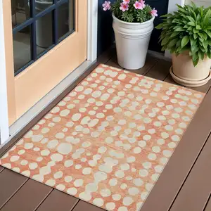 Photo of Coral And Ivory Abstract Washable Indoor Outdoor Area Rug