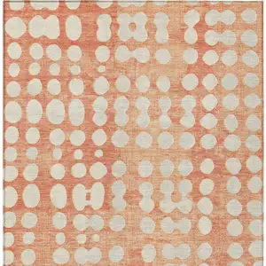 Photo of Coral And Ivory Abstract Washable Indoor Outdoor Area Rug