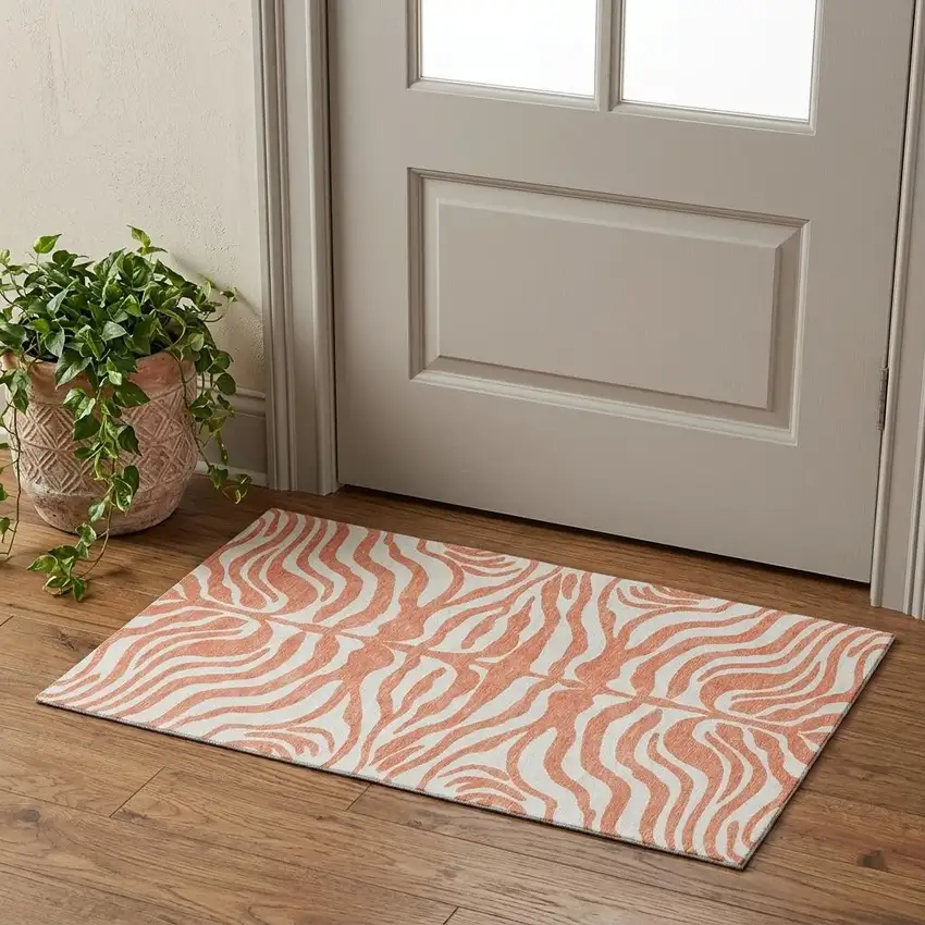 Coral And Ivory Animal Print Washable Area Rug With UV Protection Photo 1
