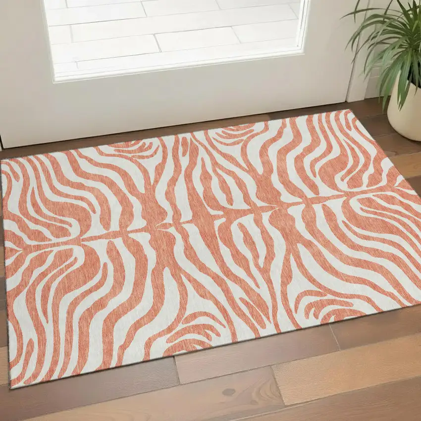 Coral And Ivory Animal Print Washable Area Rug With UV Protection Photo 1