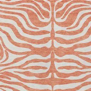 Photo of Coral And Ivory Animal Print Washable Indoor Outdoor Area Rug