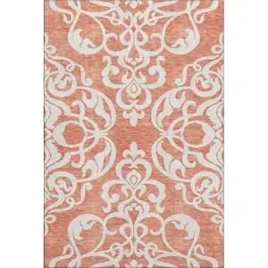 Photo of Coral And Ivory Damask Washable Area Rug With UV Protection