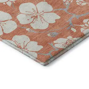 Photo of Coral And Ivory Floral Washable Area Rug With UV Protection