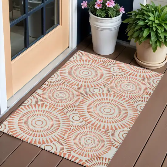 Coral And Ivory Geometric Washable Indoor Outdoor Area Rug Photo 1