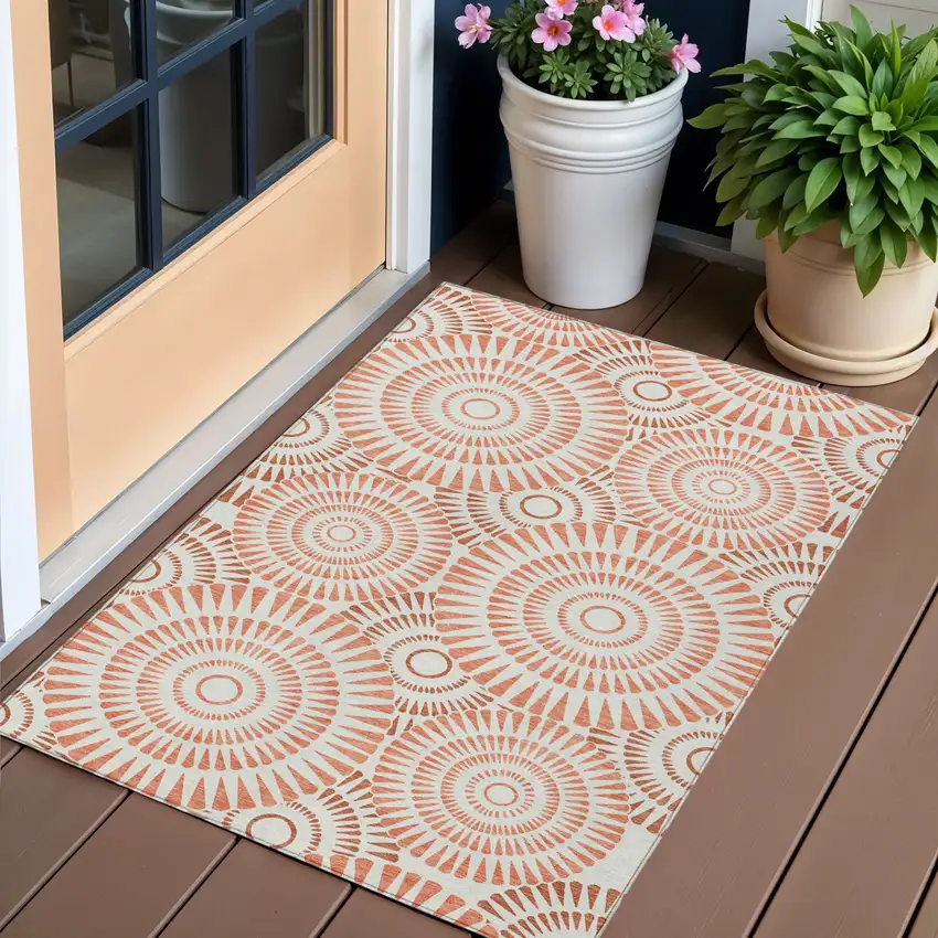 Coral And Ivory Geometric Washable Indoor Outdoor Area Rug Photo 1