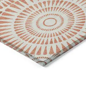 Photo of Coral And Ivory Geometric Washable Indoor Outdoor Area Rug