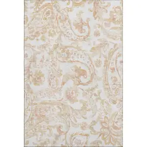 Photo of Coral And Ivory Paisley Washable Area Rug With UV Protection
