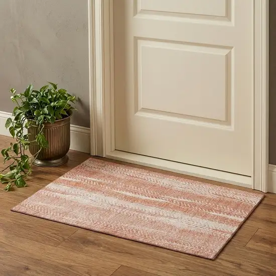 Coral And Ivory Striped Washable Area Rug With UV Protection Photo 1