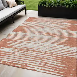 Photo of Coral And Ivory Striped Washable Indoor Outdoor Area Rug