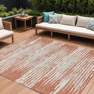 Photo of Coral And Ivory Striped Washable Indoor Outdoor Area Rug