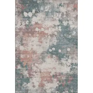 Photo of Coral And Teal Abstract Washable Area Rug With UV Protection