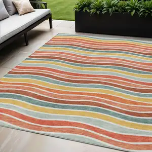 Photo of Coral Gold And Peach Striped Washable Indoor Outdoor Area Rug