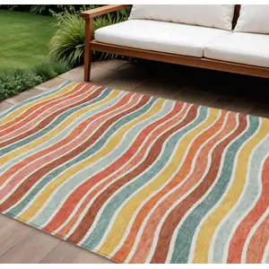 Photo of Coral Gold And Peach Striped Washable Indoor Outdoor Area Rug