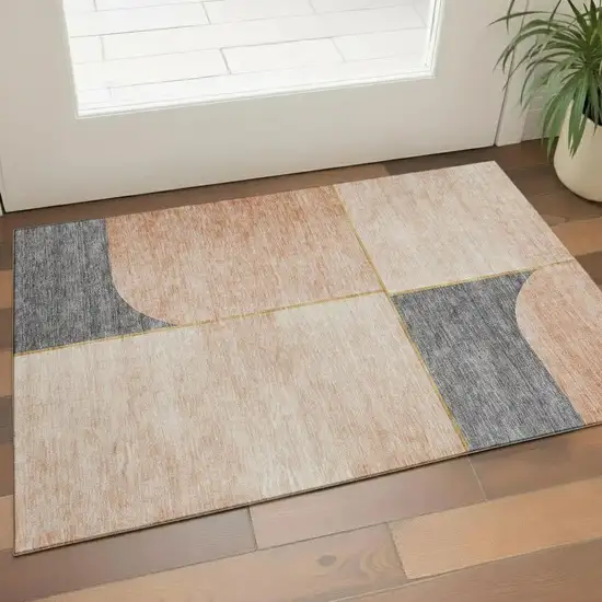 Coral Gray And Gold Geometric Washable Area Rug With UV Protection Photo 1