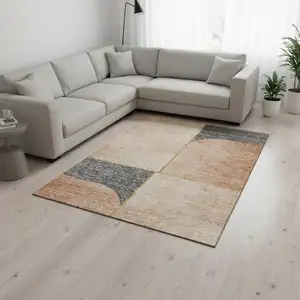 Photo of Coral Gray And Gold Geometric Washable Area Rug With UV Protection