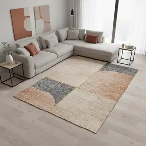 Photo of Coral Gray And Gold Geometric Washable Area Rug With UV Protection