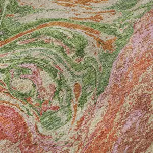 Photo of Coral Green And Peach Abstract Washable Area Rug With UV Protection