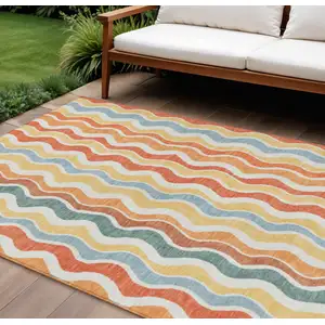 Photo of Coral Ivory And Gold Striped Washable Indoor Outdoor Area Rug