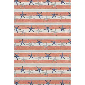 Photo of Coral Ivory And Navy Blue Geometric Washable Area Rug With UV Protection