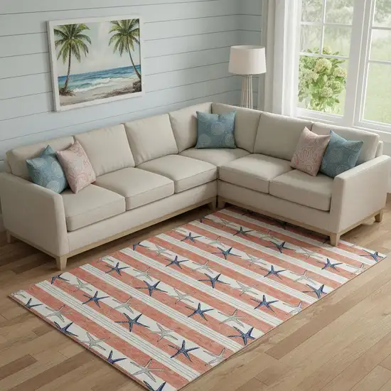 Coral Ivory And Navy Blue Geometric Washable Area Rug With UV Protection Photo 1