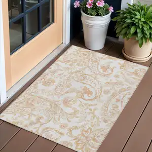 Photo of Coral Ivory And Peach Paisley Washable Indoor Outdoor Area Rug