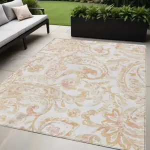 Photo of Coral Ivory And Peach Paisley Washable Indoor Outdoor Area Rug