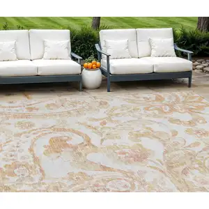 Photo of Coral Ivory And Peach Paisley Washable Indoor Outdoor Area Rug