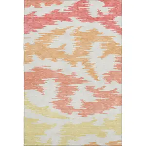 Photo of Coral Orange And Gold Abstract Washable Area Rug With UV Protection