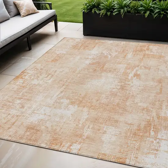 Coral Peach And Ivory Abstract Washable Indoor Outdoor Area Rug Photo 1