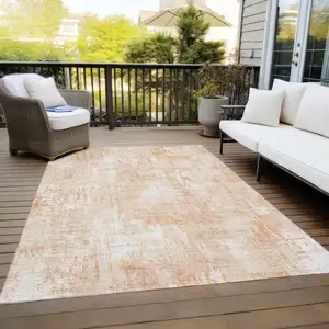 Photo of Coral Peach And Ivory Abstract Washable Indoor Outdoor Area Rug