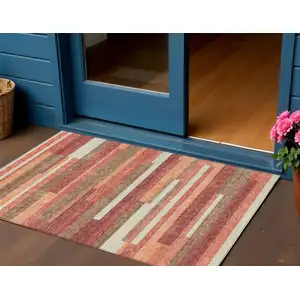 Photo of Coral Peach And Taupe Striped Washable Indoor Outdoor Area Rug
