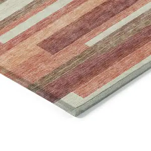Photo of Coral Peach And Taupe Striped Washable Indoor Outdoor Area Rug