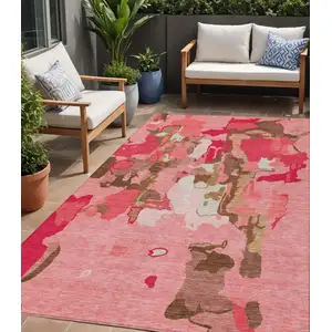 Photo of Coral Pink And Brown Abstract Washable Indoor Outdoor Area Rug