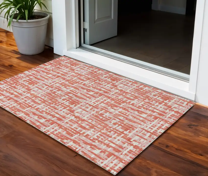 Coral Pink And Ivory Abstract Washable Indoor Outdoor Area Rug Photo 1