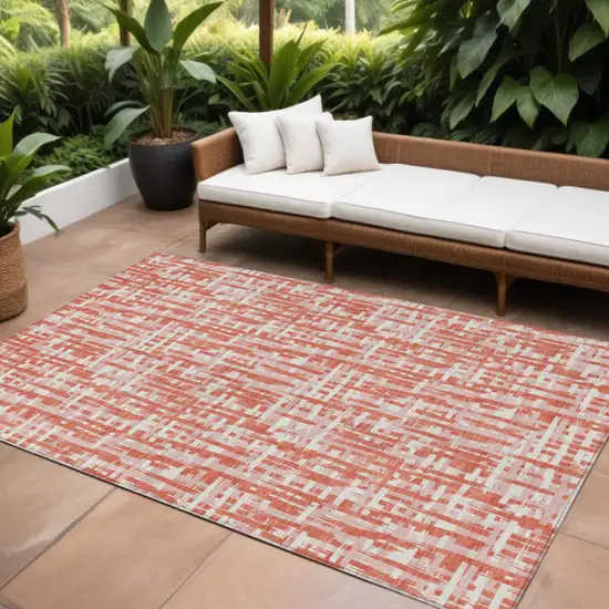 Coral Pink And Ivory Abstract Washable Indoor Outdoor Area Rug Photo 1