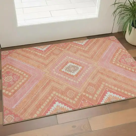 Coral Pink And Ivory Tribal Washable Area Rug With UV Protection Photo 2