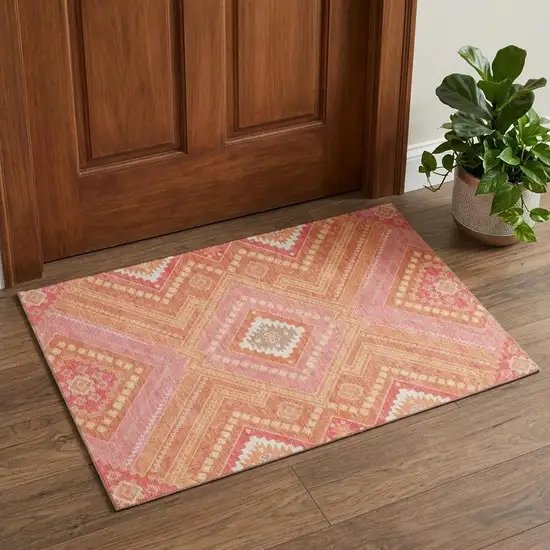 Coral Pink And Ivory Tribal Washable Area Rug With UV Protection Photo 1