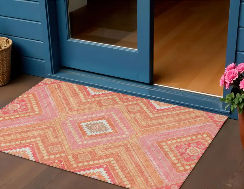 Coral Pink And Ivory Tribal Washable Indoor Outdoor Area Rug Photo 1