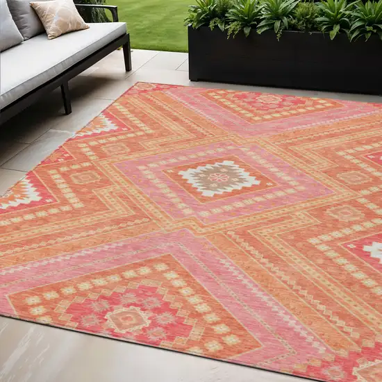 Coral Pink And Ivory Tribal Washable Indoor Outdoor Area Rug Photo 1